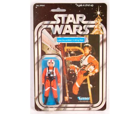 A rare ex-shop stock condition original vintage Kenner made Star Wars MOC carded action figure ' Luke Skywalker - X Wing Pilo