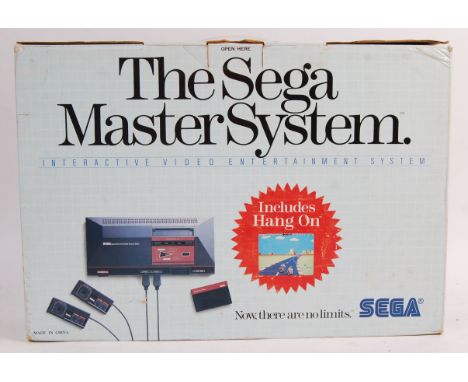 An original vintage Sega Master System mk 1 games console complete in original early briefcase type box with two controllers,