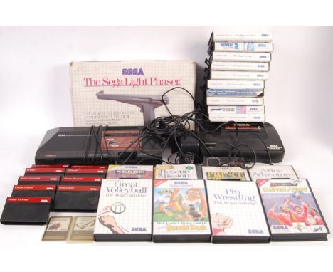 A vintage Sega Master System I &amp; II video games computer consoles each with aerials and A/C adaptors, 1x control pad, Seg