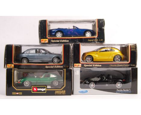 A collection of 5x boxed 1/18 scale diecast model cars comprising: Welly Porsche Boxster S, Maisto Chrysler Pronto Cruizer Or