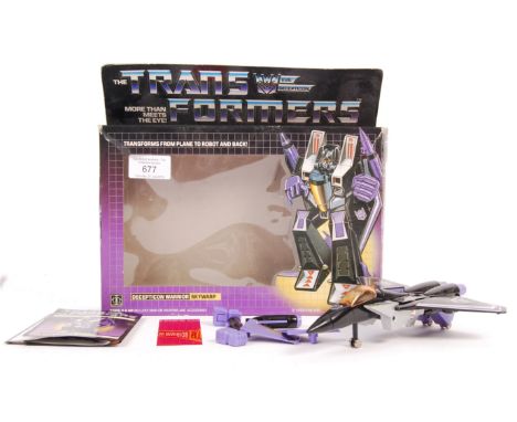 An original vintage Hasbro made Transformers action figure toy Evil Decepticon Warrior Skywarp. Model is in good order with s