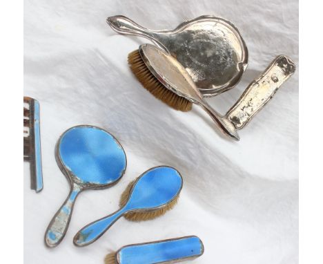 A George V silver and enamel part dressing table set, London, 1925 together with another silver backed part dressing table se