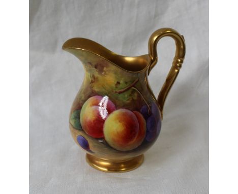 A Royal Worcester porcelain jug painted with peaches and black grapes to a naturalistic background, signed by Albert Shuck, p