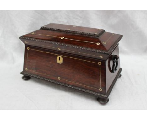 A Victorian rosewood sarcophagus shaped tea caddy, with a quarter reel moulded border, inlaid with mother of pearl, hanging r