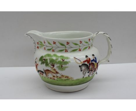 A 19th century pottery jug, with raised decoration of a Stag hunting scene, possibly New Hall, 13cm high 