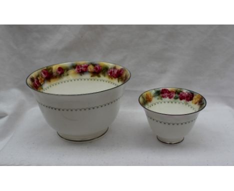 A Royal Worcester porcelain part tea service, transfer and infil decorated with red and yellow flowers, comprising six tea cu
