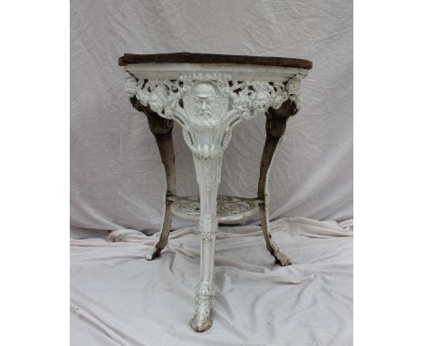 A 19th century cast iron pub table, the circular planked top above a white painted base with a portrait bust of the cricketer