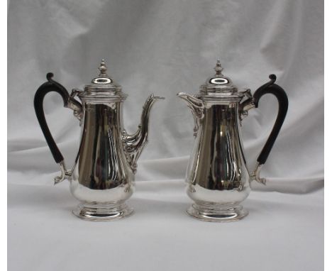 A George VI silver coffee pot, with a turned finial and domed top above a baluster body and spreading foot, together with a m