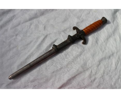 A World War II Third Reich Heer Officers Dagger, with an orange celluloid grip, the pommel decorated with oak leaves, the cro