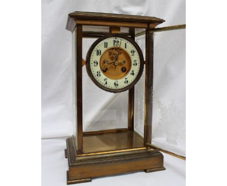 A 19th brass four glass mantle clock, with floral etched glass panels, the dial with insight movement and Arabic numerals, th