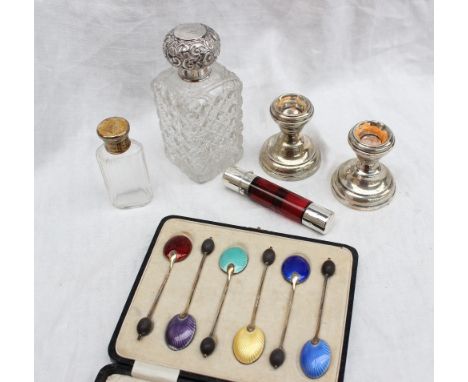 A silver topped scent bottle together with a silver gilt topped scent bottle, a cranberry glass and white metal double ended 