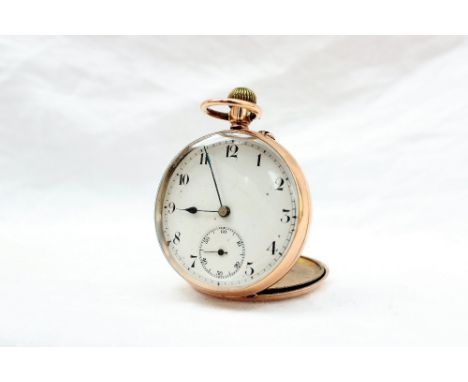 A 9ct gold keyless wound open faced pocket watch, the enamel dial with Arabic numerals and a seconds subsidiary dial 