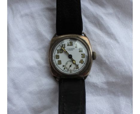 A white metal mid size wristwatch with a white enamel dial and Arabic numerals with a seconds subsidiary dial, inscribed J.W.