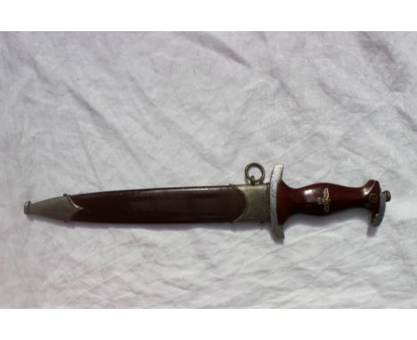 A German SA Dagger, the double edged blade inscribed 'Ulles fur Deutschland', stamped RZM over M7/36, plated crossguard and t
