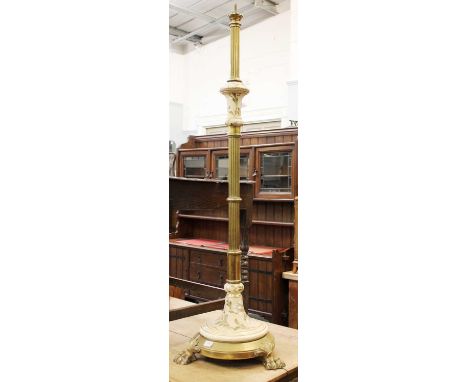 A Brass and Porcelain Standard Lamp, with reeded supports, 140cm high