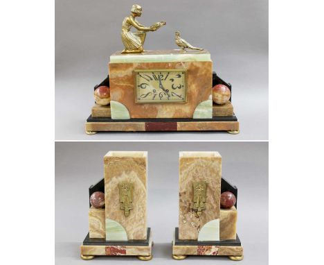 An Art Deco Marble and Onyx Striking Mantel Clock GarnitureClock case with minor chips, one of the garniture with chips in pa