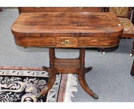 A Regency Rosewood Brass Inlaid Card Table, 93cm by 45cm 76cmThe top with scratches. The brass inlay is lifting and there are