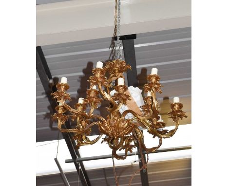 A Gilt Metal Sixteen Light Electrolier, with foliate casting, approximately 45cm drop
