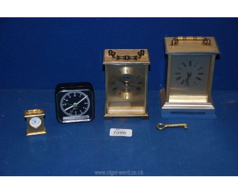 Three Metamec Quartz carriage clocks, (small, medium and large) plus another black clock.