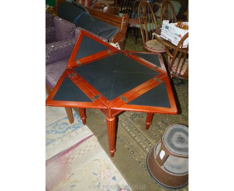 A golden Mahogany finished  *envelope/card table standing on turned and lobed legs, 23 3/4" x 23 3/4" extending to 33 1/2" x 