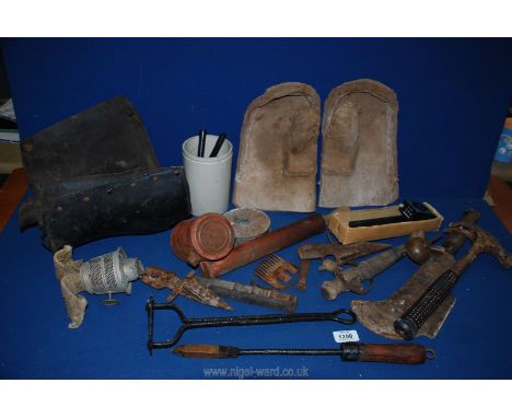 A box of antique farm tools including pair of good hedging gloves and old spats.
