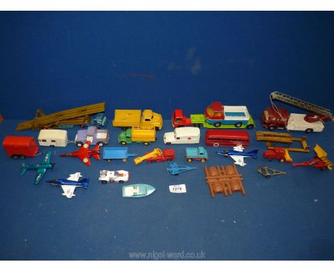 A small quantity of Dinky toys including red bus, fire engine, Matchbox tow truck, car carrier, first aid bus, three Matchbox