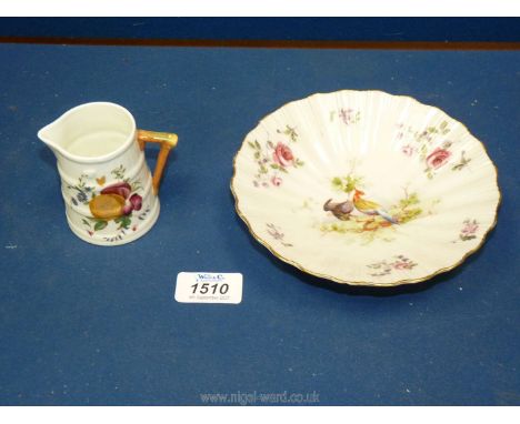 A Royal Worcester bonbon dish decorated with birds and roses, with dark green mark to base and a Royal Worcester cream jug wi