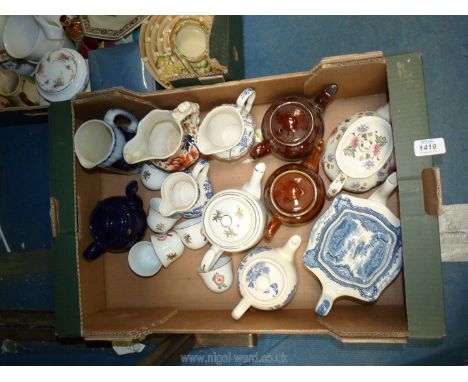 A quantity of teapots and jugs including Royal Worcester Chinese Flower, Sadler, oriental part Teaset etc.