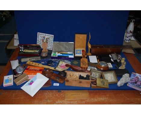 A box of miscellanea to include playing cards, boxes of dominoes, chess pieces, cribbage board, handwriting pens and book and