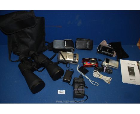 A quantity of Cameras to include a G E 10.1 megapixel digital in red, an Olympus D320L digital, Sanyo 6 megapixel digital mov