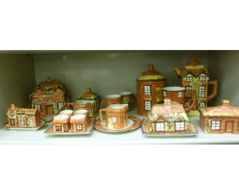 Price Kensington pottery, cottage design tableware: to include a biscuit jar, a condiments set and a tall teapot         OS5