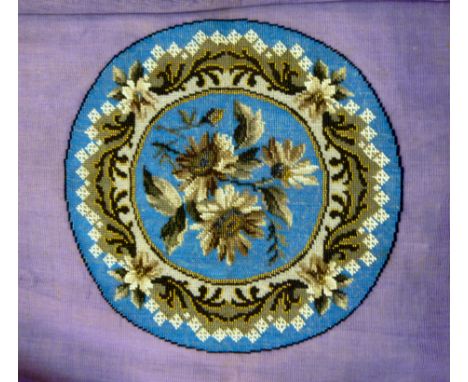 A coloured ceramic beadwork panel  12''dia; and another similar, incorporating wool tapestry  14.5''dia       OS2