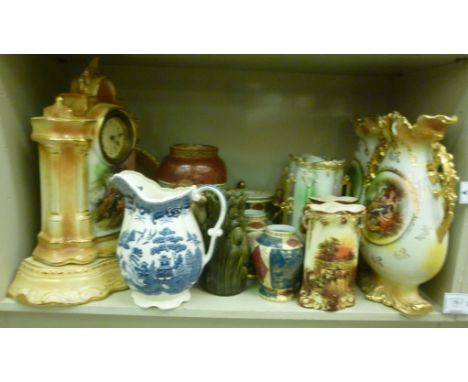 Early 20thC Continental ceramic ornaments: to include a pair of twin handled vases with vignette figure studies  15''h; and a