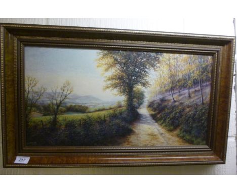 K East - a landscape with a path by a bluebell wood  oil on board  bears a signature  11'' x 22'' framed         HSR