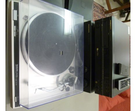 A Technics Quartz record deck; a Marantz stereo amplifier and separate CD player with remote control; and a pair of KEF floor