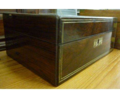 A 19thC mother-of-pearl inlaid rosewood workbox, having a hinged lid, enclosing a fitted interior  5''h  12''w       F