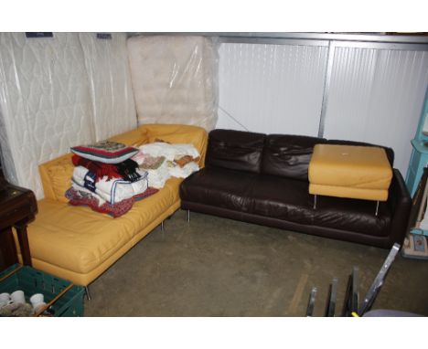 A leather corner suite and pouffe