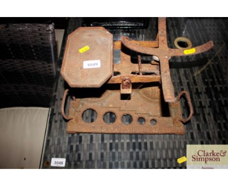 A set of vintage cast iron scales with apertures for weights