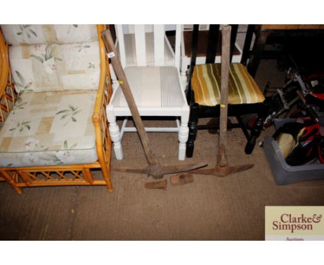 Two vintage pick axes; an iron wedge and a sledge hammer head