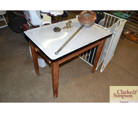 An enamel top kitchen table fitted single end drawer raised on square tapering supports