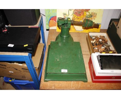 A set of green cast iron platform scales and weights