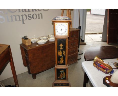 A Milcord (Essex Ltd) granddaughter clock, decorated with figures etc