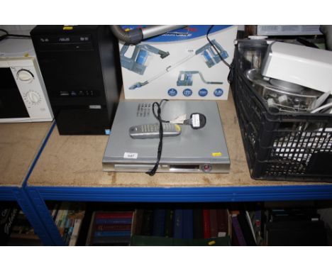 A Phillips DVD player/recorder with remote control.