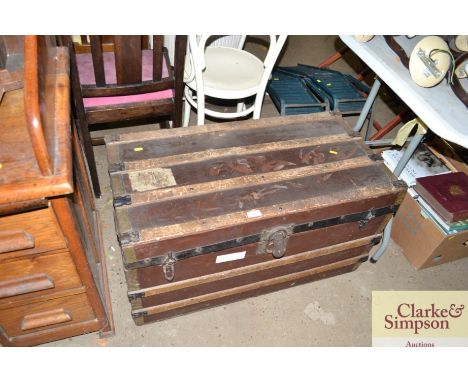 A wooden and metal bound trunk