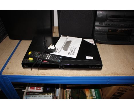 A LG Freeview/DVD recorder with remote control.