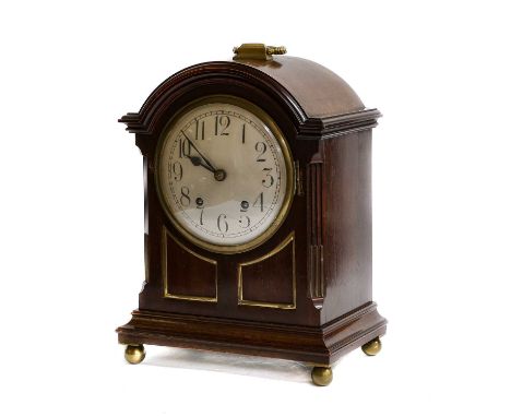 A Regency style mahogany striking table clock, movement stamped W&amp;H Sch, inside back door with retailers plaque for Penli