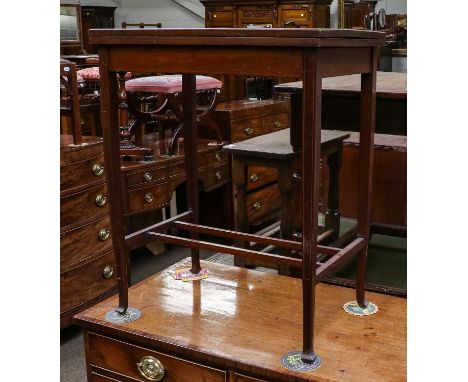 An Edwardian inlaid mahogany foldover card table, with sqaure tapering supports, 61cm by 39cm by 73cm