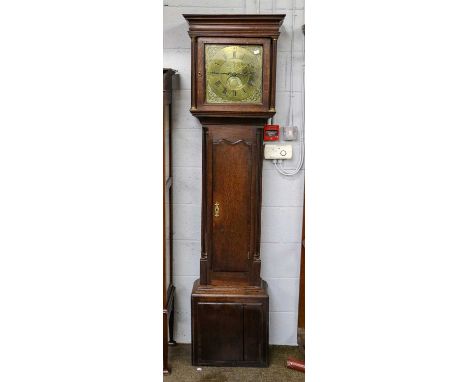 An oak thirty hour longcase clock, 12" square brass dial signed T Travis, 18th centuryCondition report: With pendulum and one