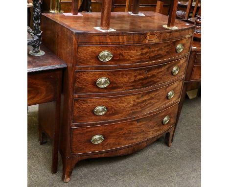 A Regency mahogany and ebony strung bowfront chest of drawers, with four graduated drawers, and on splayed bracket feet