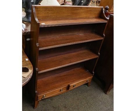 An early 20th century mahogany waterfall bookcase with reeded uprights, the base with two frieze drawers on splayed feetCondi